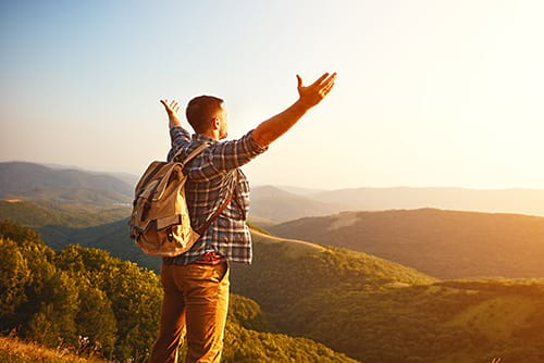 Man on top of mountain